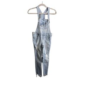 Squeeze light wash distressed skinny raw leg overalls 2 button adj straps. Y12